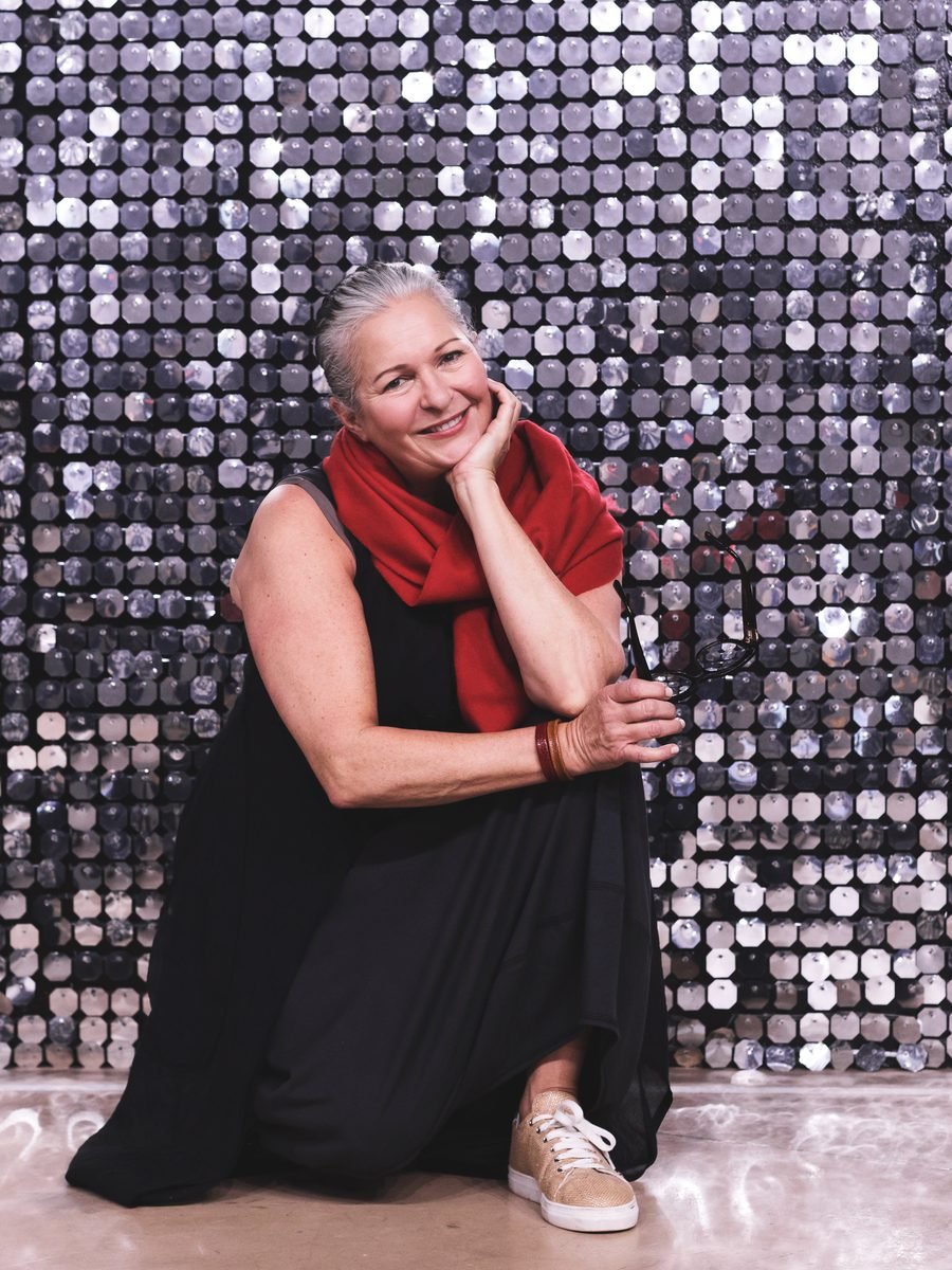 Béatrice black cocktail dress worn in a mirrored room